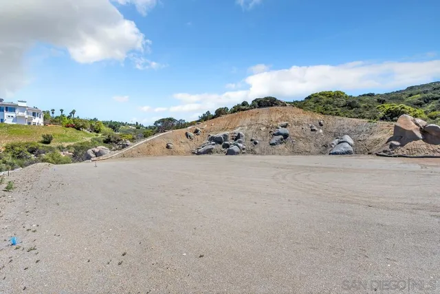 a view of a road with an ocean view