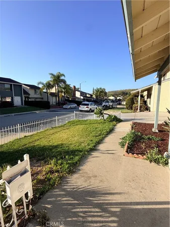 a view of a swimming pool and a yard