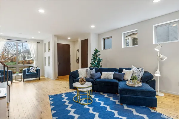 a living room with furniture and a table