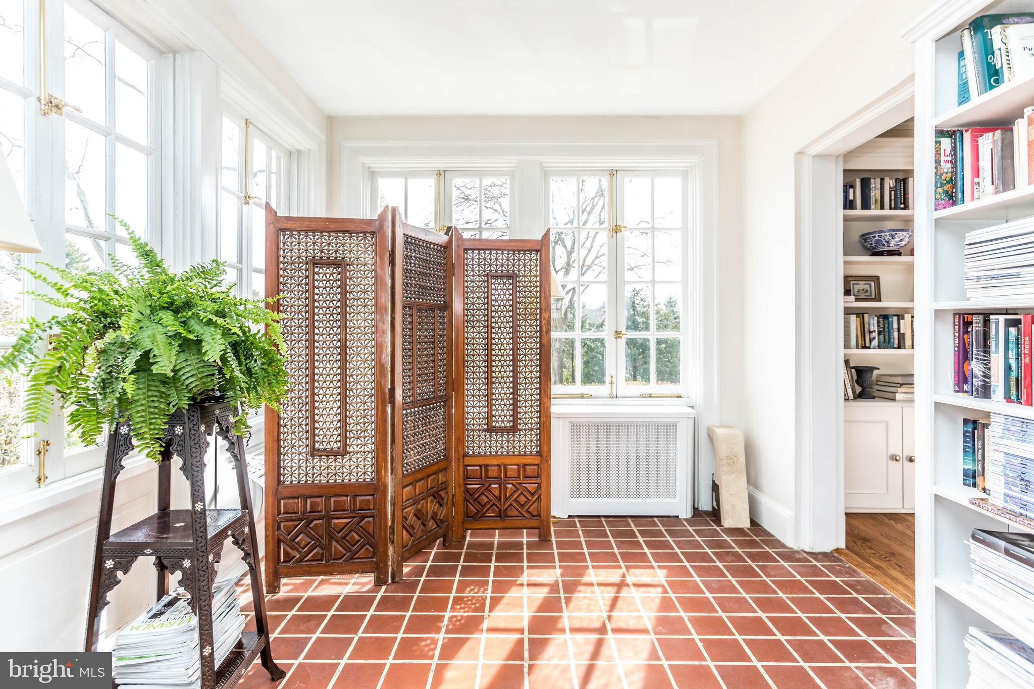 601 Somerset Road Baltimore, MD 21210 - Photo 27 of 52 Walls of windows in this sunroom