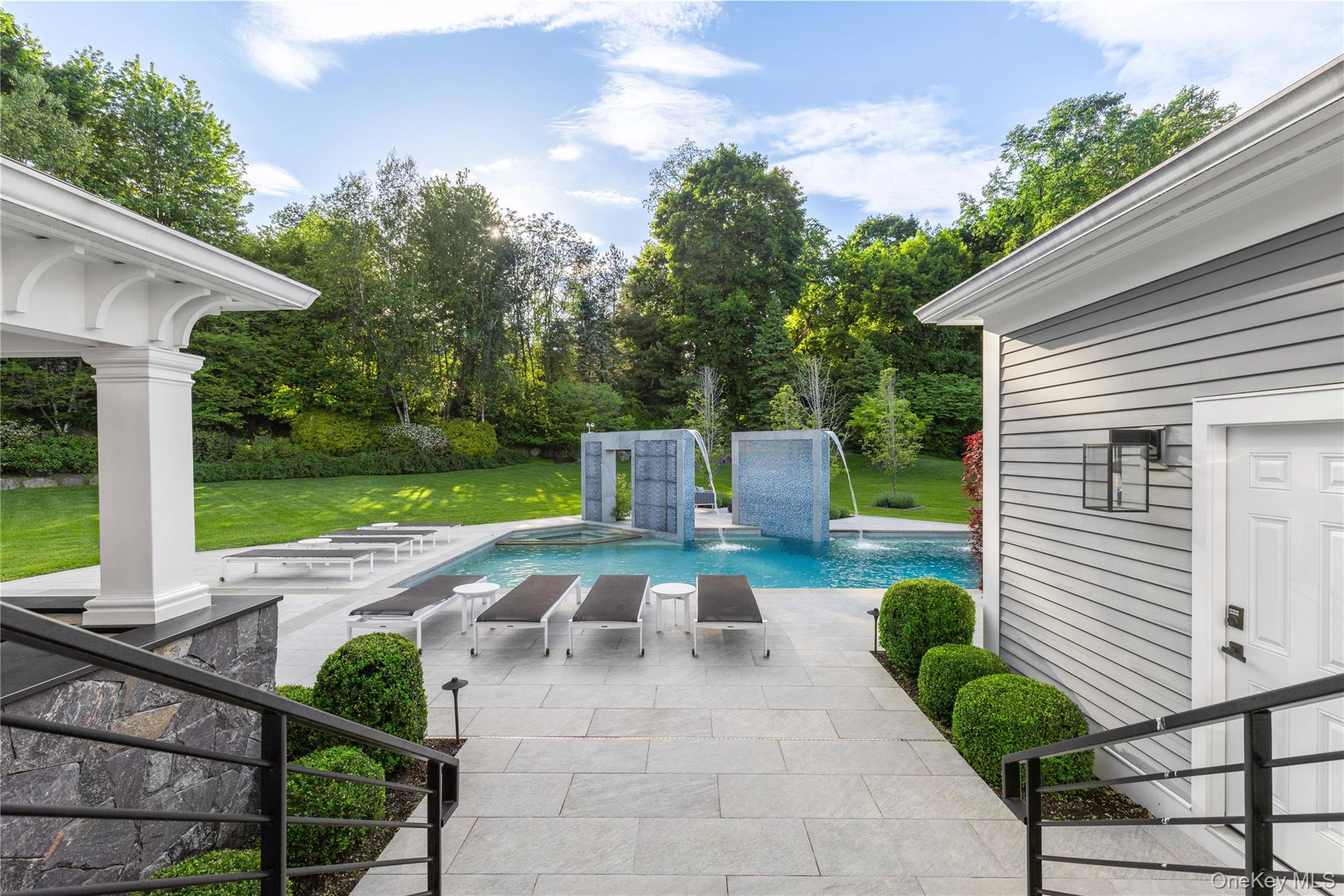 23 Pheasant Drive Rye, NY 10580 - Photo 33 of 35 French doors from the new great room lead directly to the pool, cabanas and entertainment space
