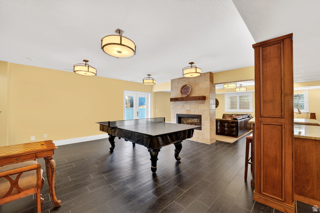 714 Draper Heights Way Draper, UT 84020 - Photo 57 of 88 Rec room with dark wood-style floors and a large fireplace