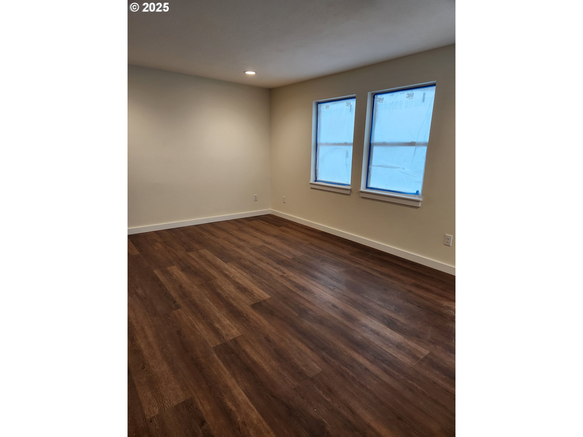 2604 J Street Springfield, OR 97477 - Photo 11 of 11 a view of an empty room with wooden floor and a window