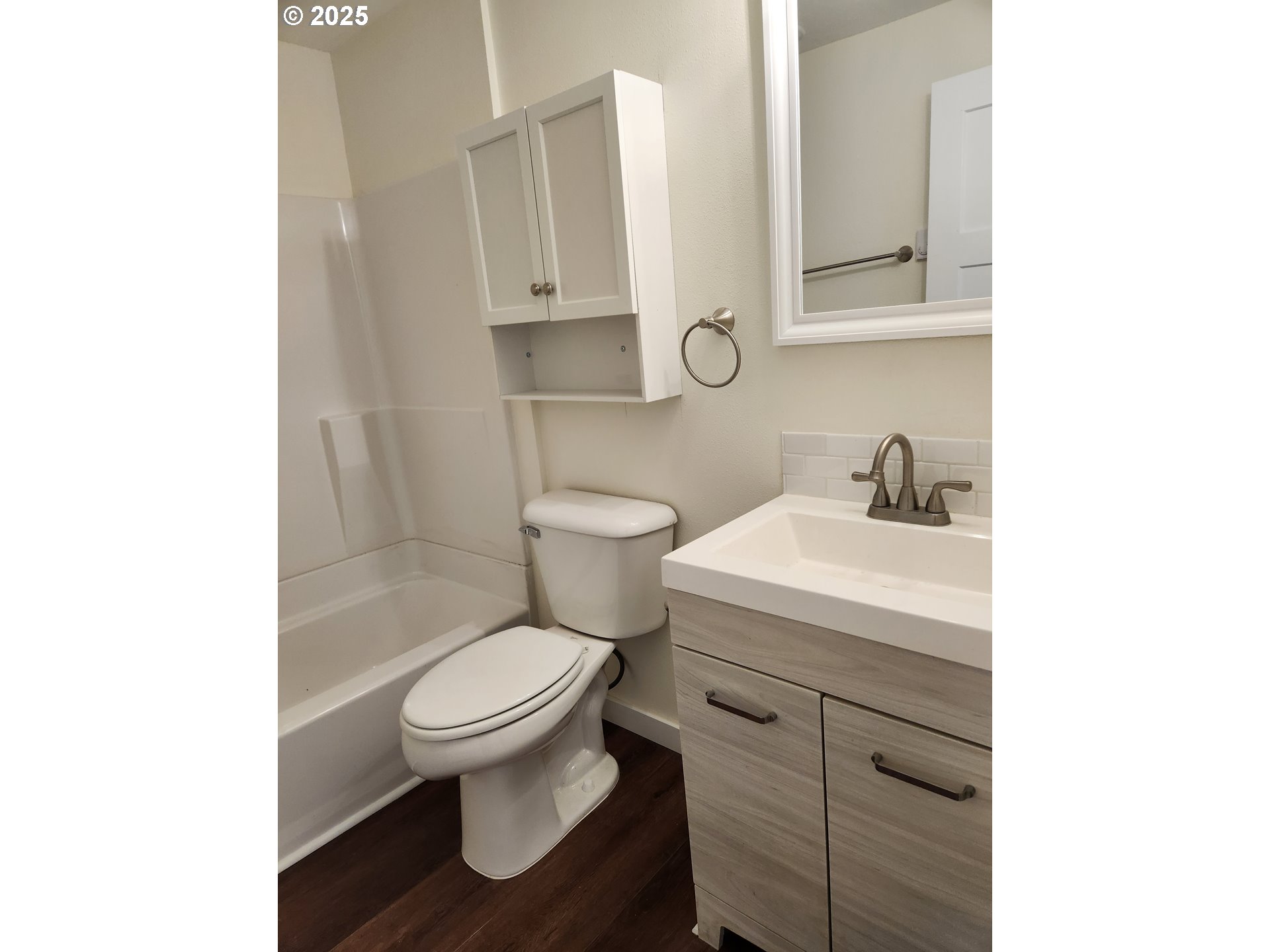 2604 J Street Springfield, OR 97477 - Photo 6 of 11 a bathroom with a sink a toilet and mirror