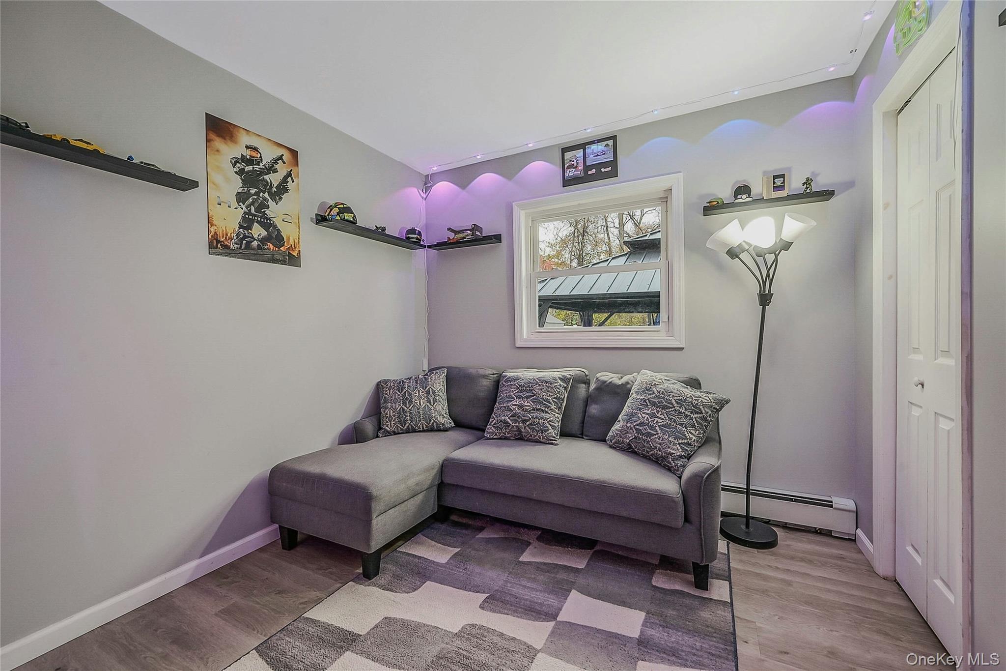 425 Blue Point Road Farmingville, NY 11738 - Photo 14 of 32 a living room with furniture and a window