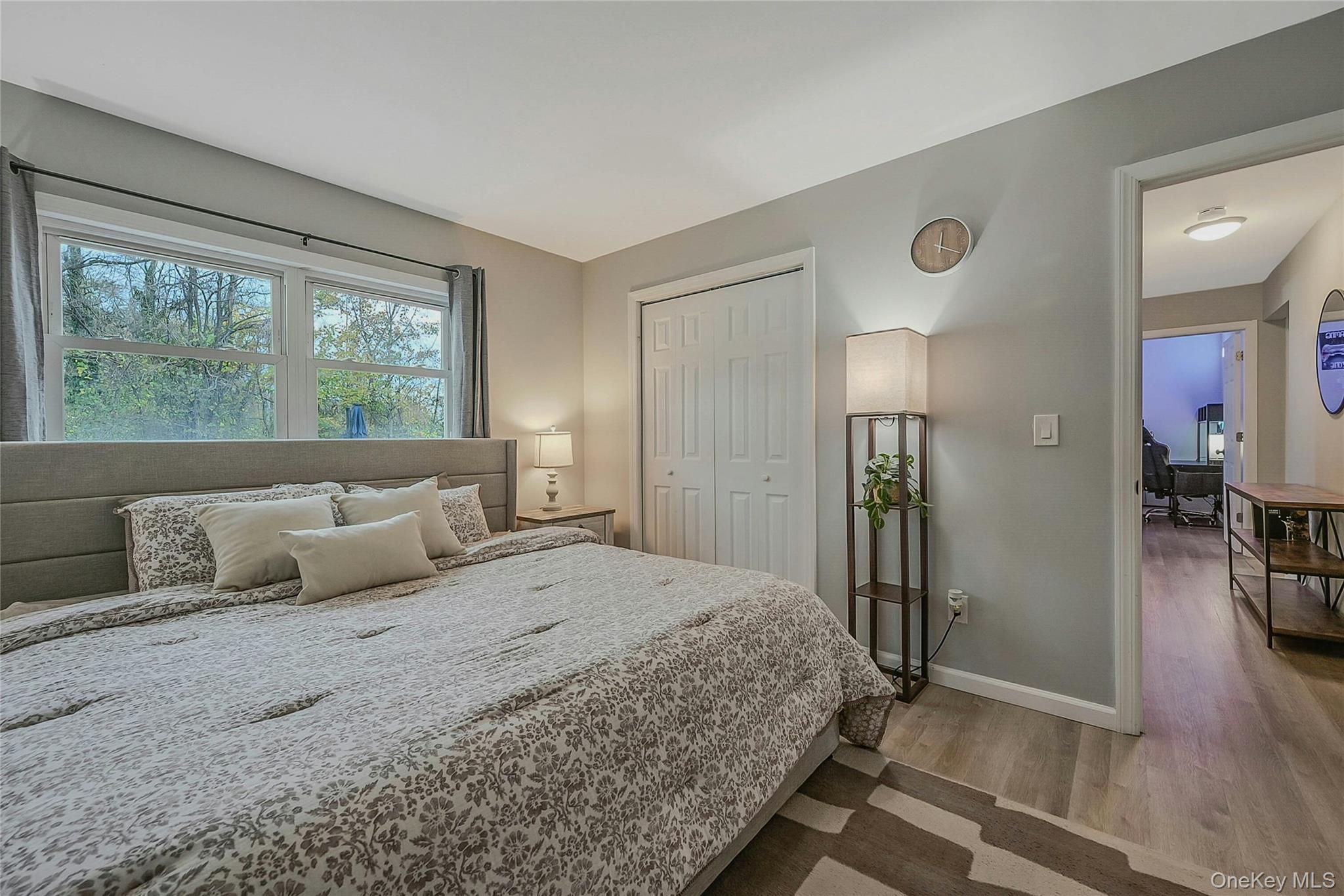 425 Blue Point Road Farmingville, NY 11738 - Photo 17 of 32 a bedroom with a bed and a large window