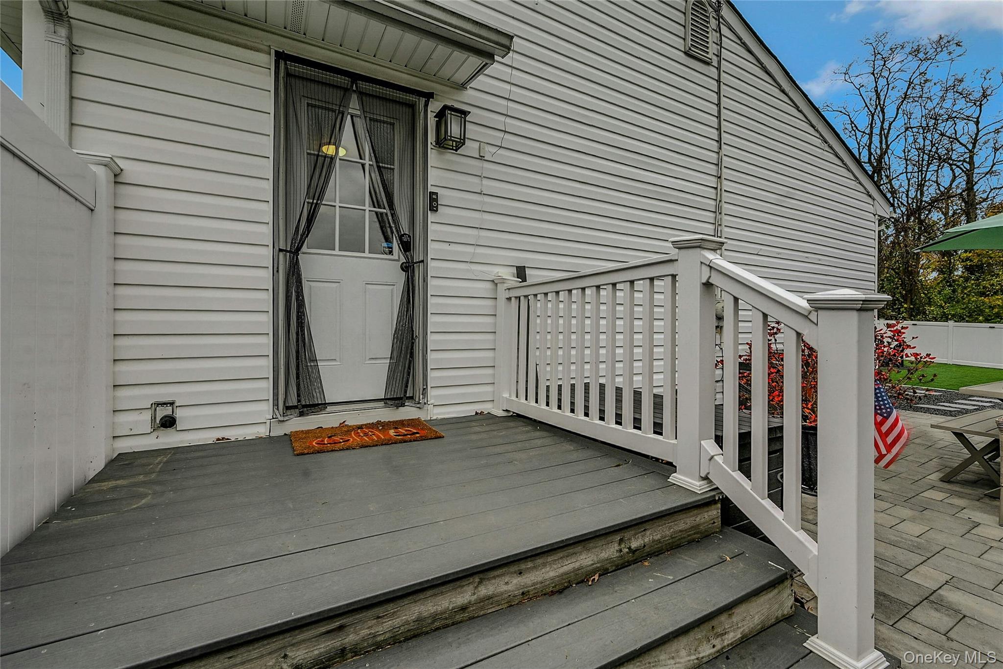 425 Blue Point Road Farmingville, NY 11738 - Photo 19 of 32 a view of a balcony with door