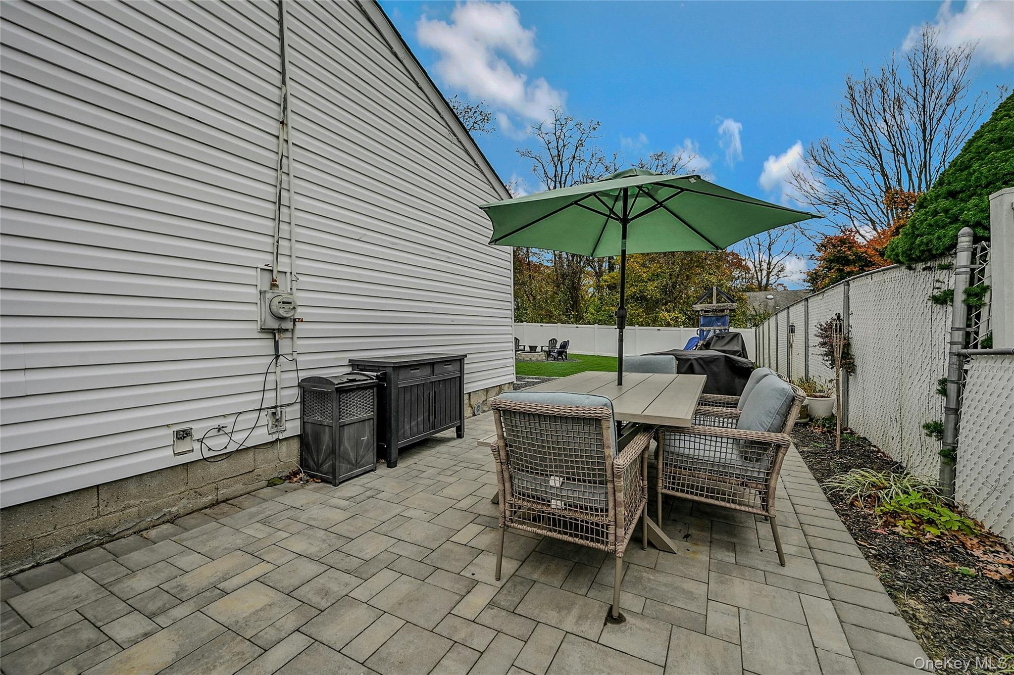 425 Blue Point Road Farmingville, NY 11738 - Photo 20 of 32 a view of a lounge chairs in backyard