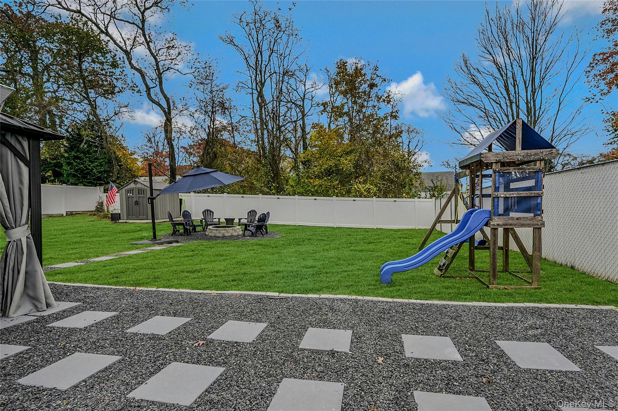 425 Blue Point Road Farmingville, NY 11738 - Photo 24 of 32 a view of outdoor space with playground and green space