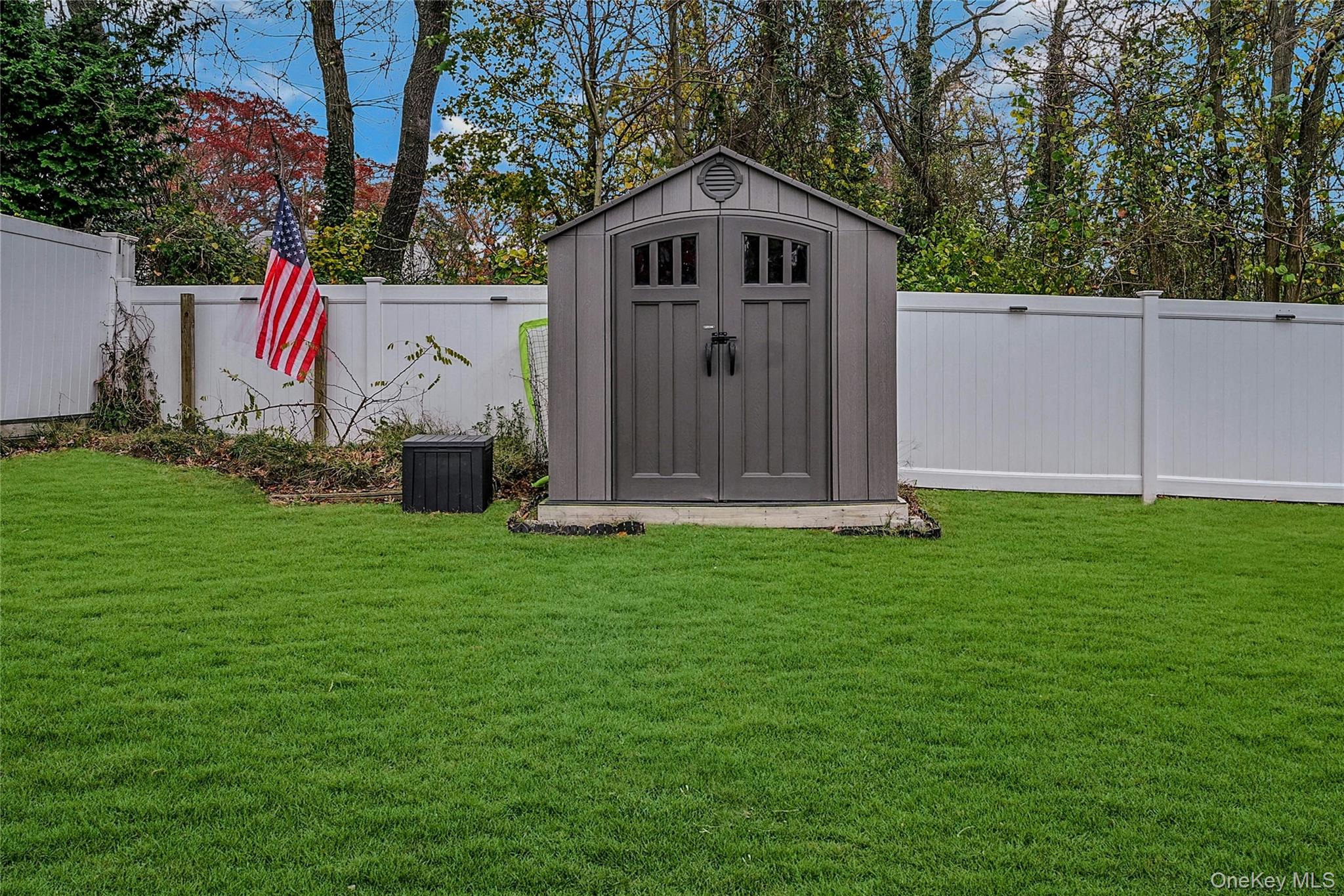 425 Blue Point Road Farmingville, NY 11738 - Photo 26 of 32 a front view of a house with garden