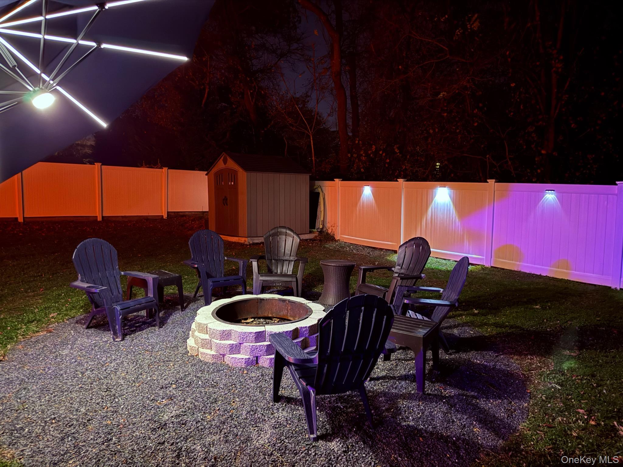 425 Blue Point Road Farmingville, NY 11738 - Photo 28 of 32 a swimming pool with outdoor seating