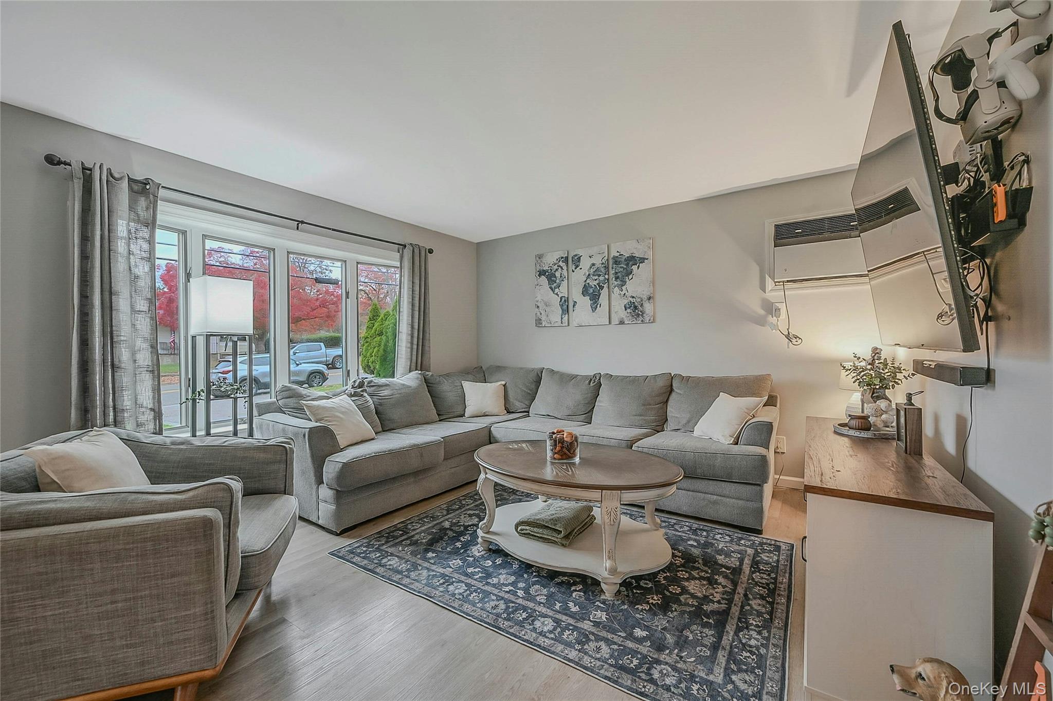 425 Blue Point Road Farmingville, NY 11738 - Photo 6 of 32 a living room with furniture and a large window