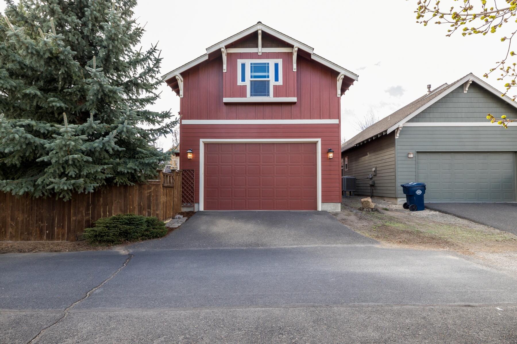 62732 Larkview Road Bend, OR 97701 - Photo 25 of 26 a front view of a house with a yard and garage