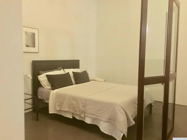 a bathroom with a sink a toilet and shower curtain