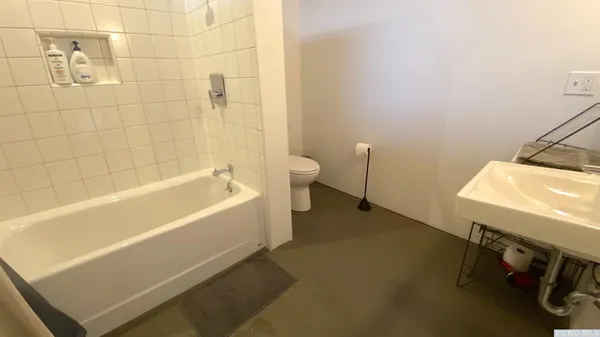 a bathroom with a sink and mirror