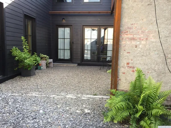 a garden view with a seating space