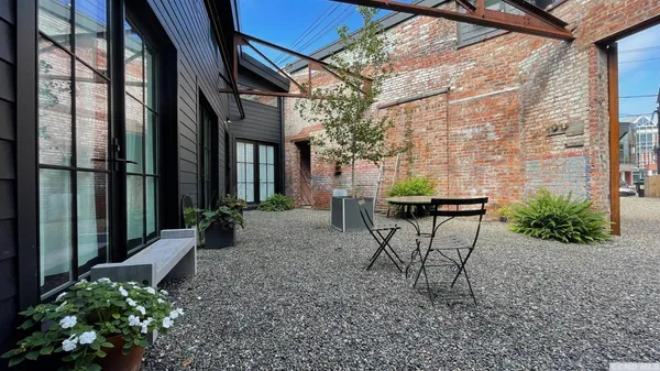 a garden with trees in front of it