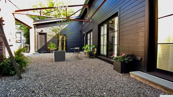 a potted plant sitting in front of a house