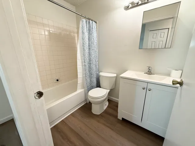 a bathroom with a toilet a sink and a shower
