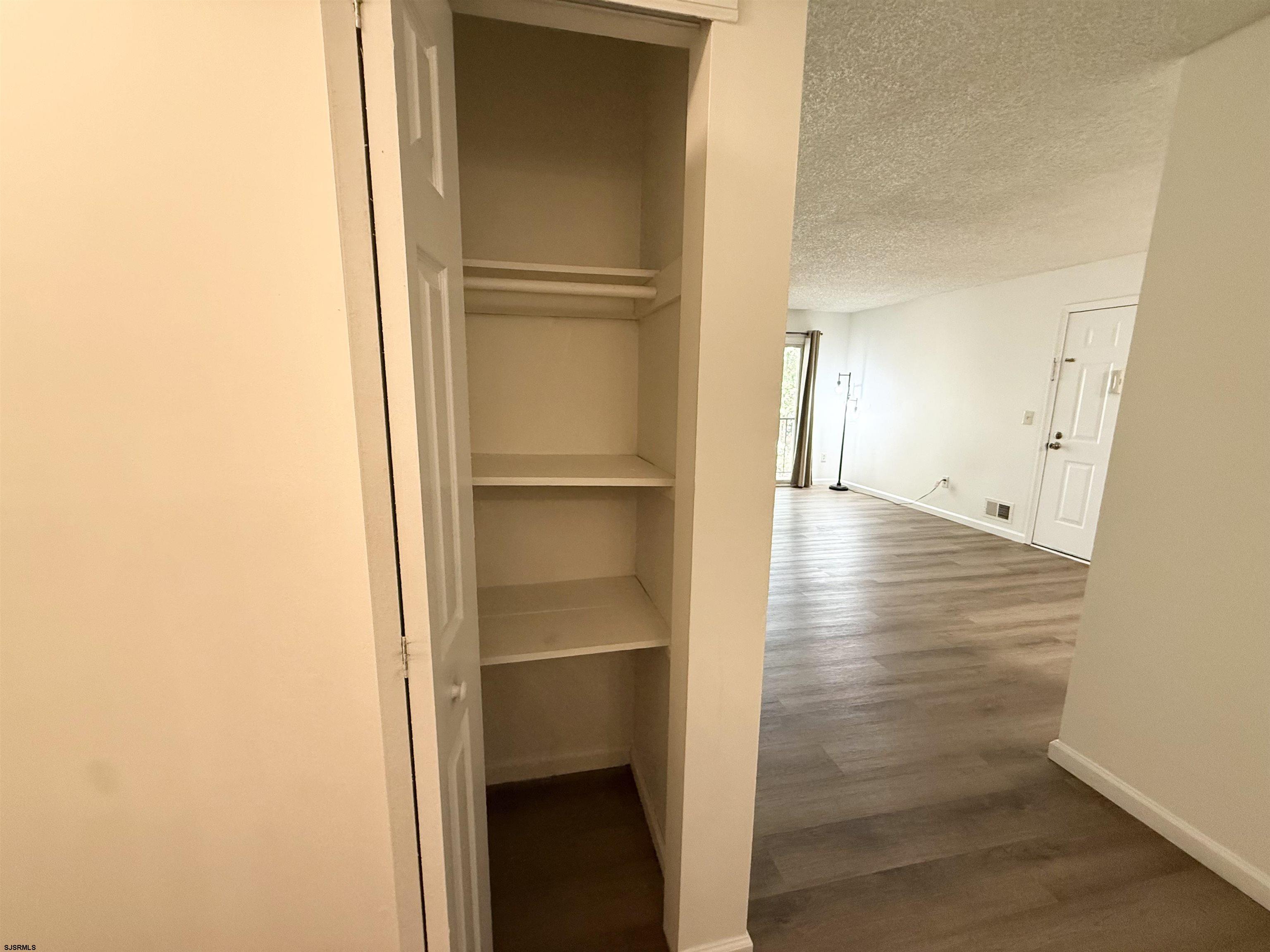 11 Colonial Court, Unit 11 Galloway Township, NJ 08205 - Photo 6 of 15 a view of empty room with wooden floor