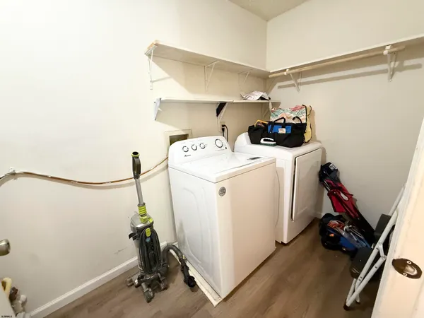 a view of a storage & utility room with washer and dryer