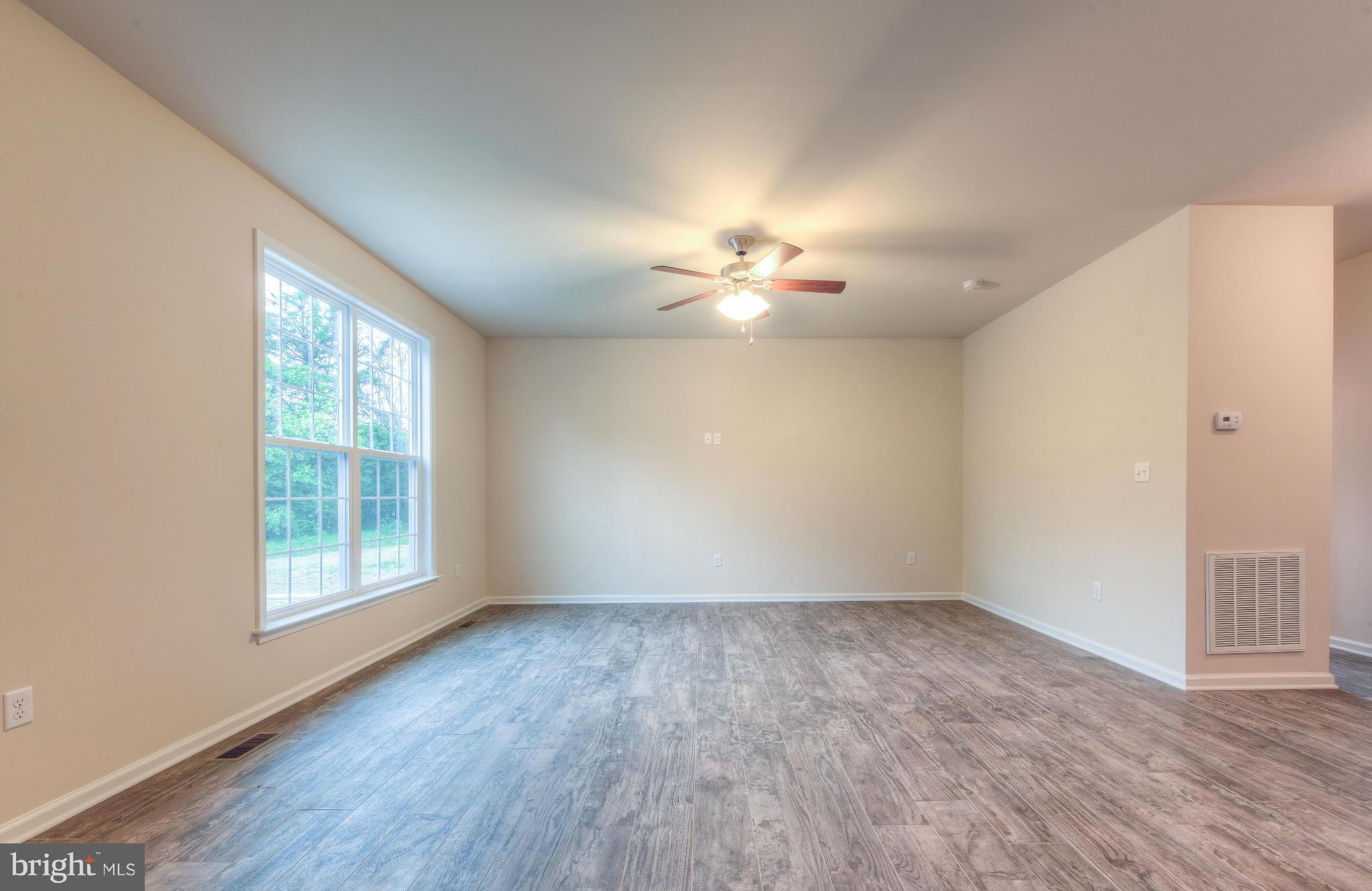 411 Birdie Road Locust Grove, VA 22508 - Photo 15 of 30 wooden floor in an empty room with a window
