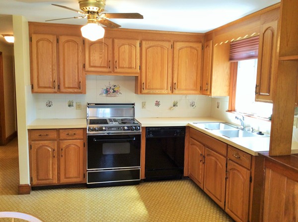 16 Dearborn Road Burlington, MA 01803 - Photo 8 of 24 a kitchen with stainless steel appliances granite countertop a stove a sink and a refrigerator