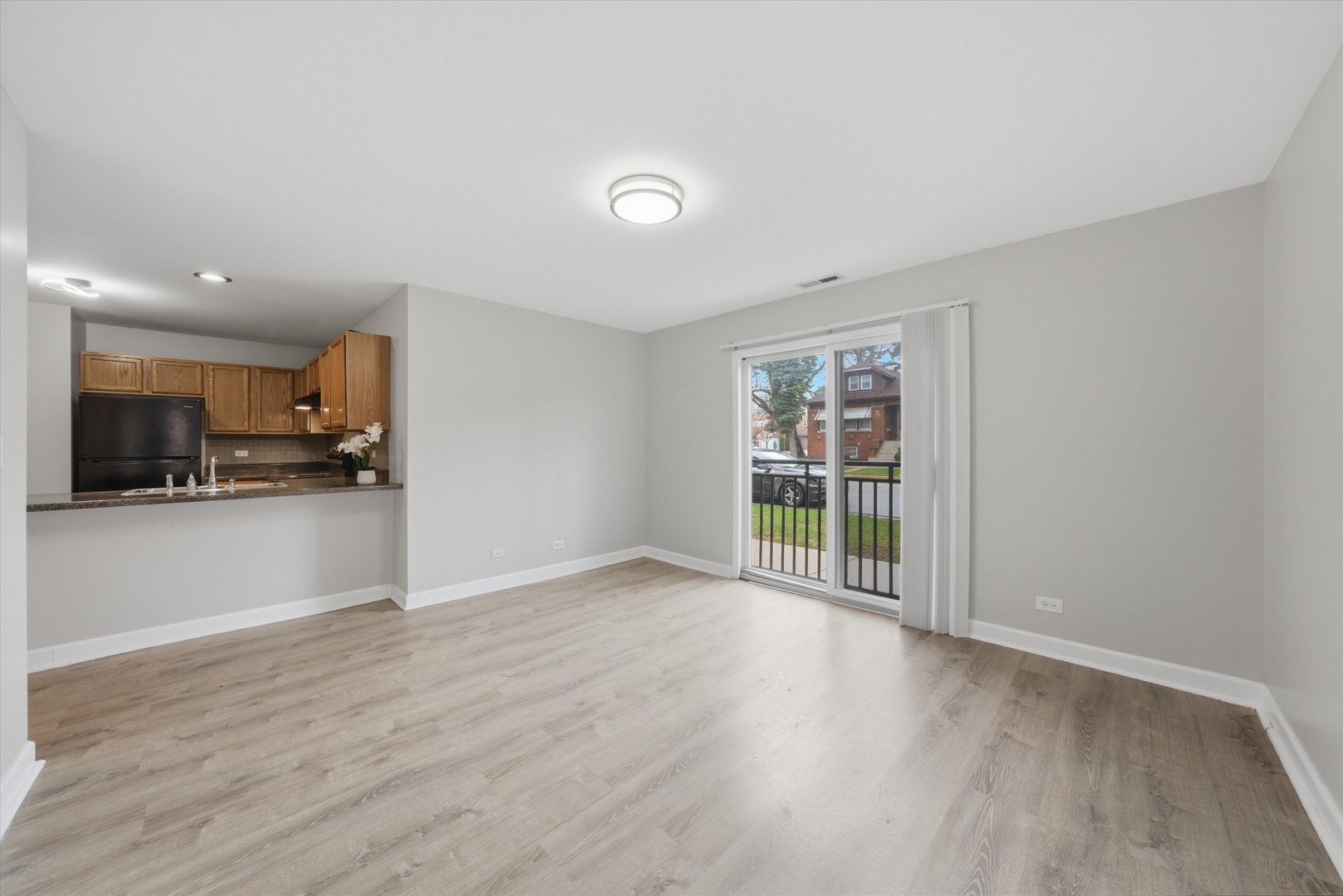 3447 Ridgeland Avenue, Unit 104 Berwyn, IL 60402 - Photo 4 of 12 a view of an empty room with kitchen appliances and a window