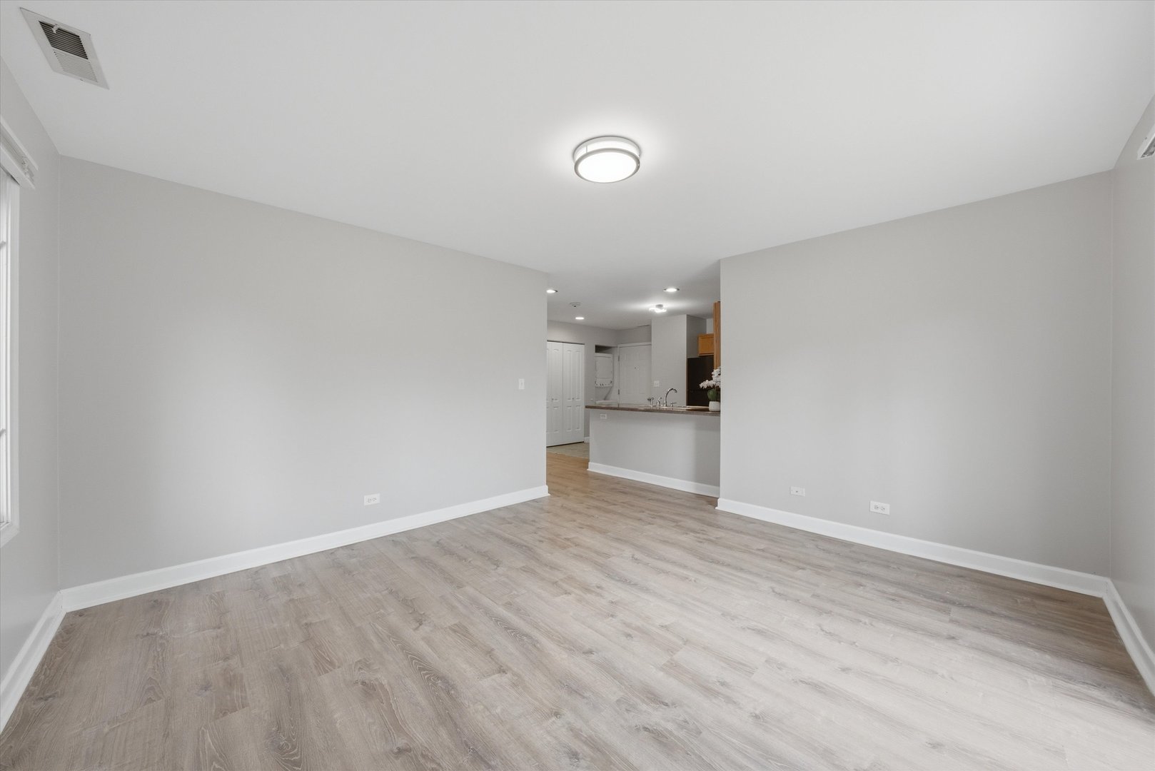 3447 Ridgeland Avenue, Unit 104 Berwyn, IL 60402 - Photo 6 of 12 a view of empty room with wooden floor