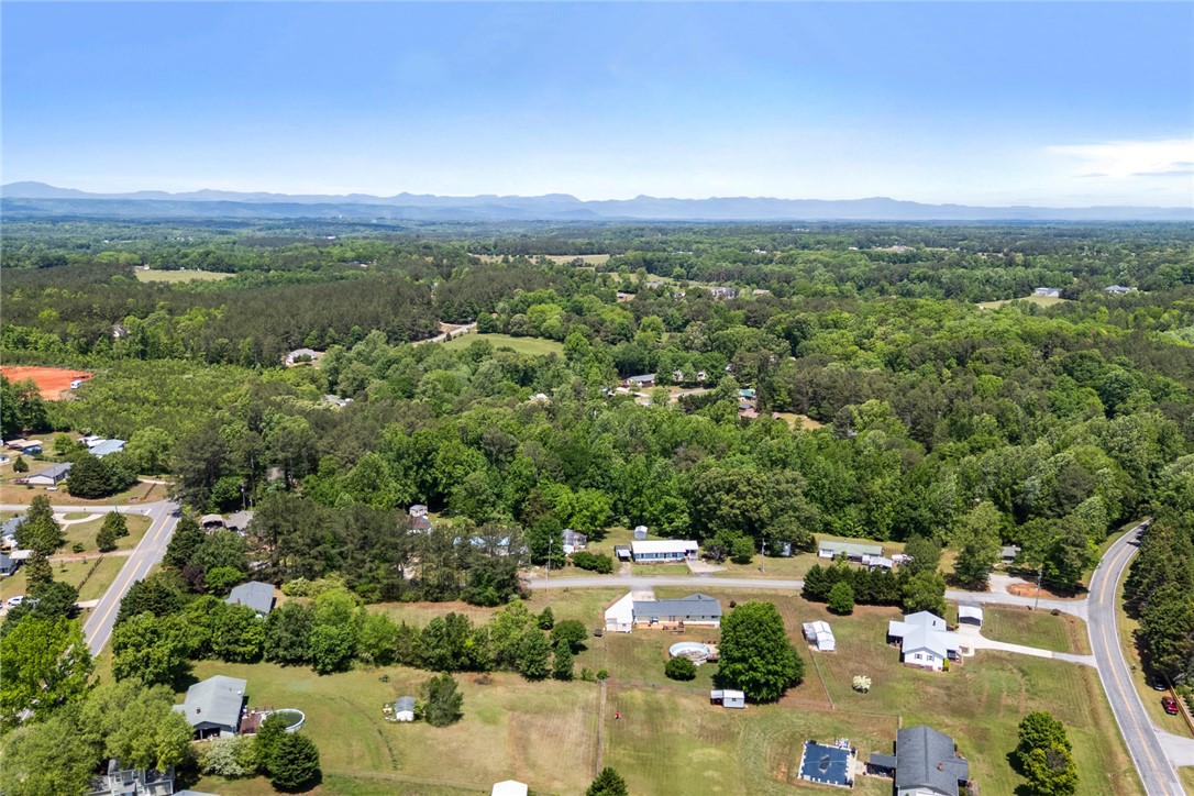 209 Short Cut Road Westminster, SC 29693 - Photo 25 of 27 This elevated view showcases a serene rural landscape with homes nestled amongst verdant trees.
