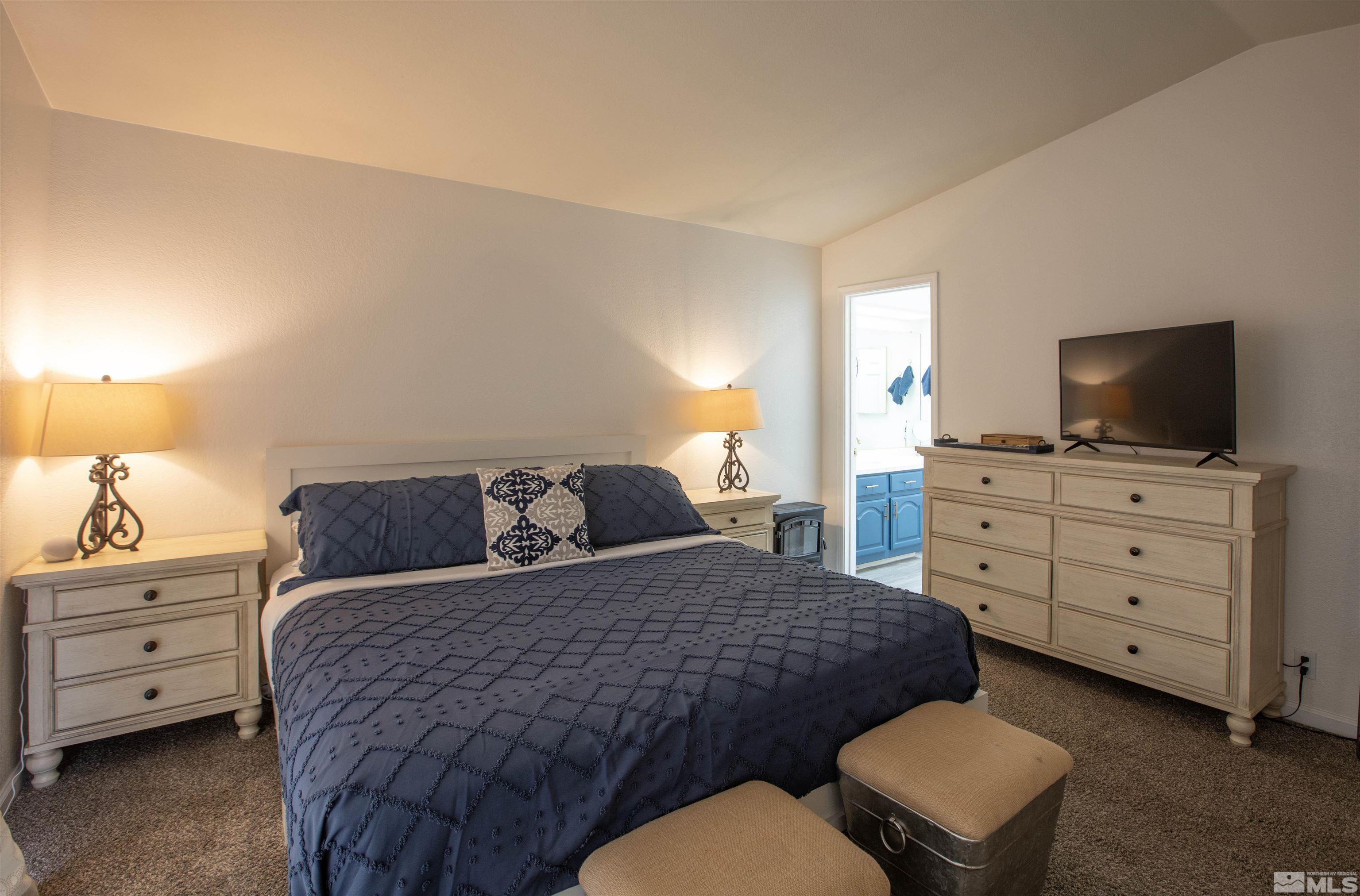 2285 Silver Ridge Drive Reno, NV 89509 - Photo 11 of 19 a bedroom with a bed and furniture