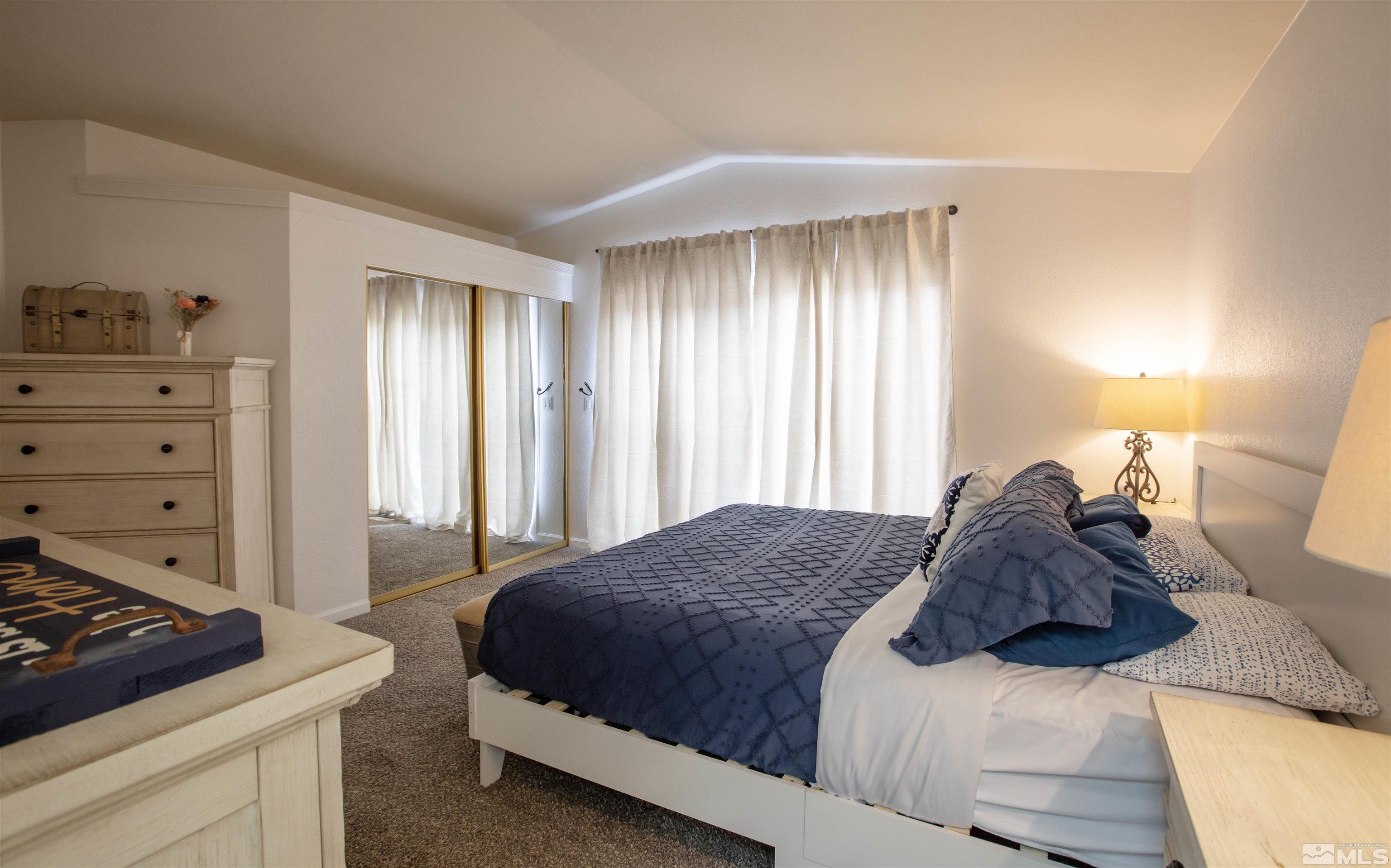 2285 Silver Ridge Drive Reno, NV 89509 - Photo 12 of 19 a bedroom with a bed and a window