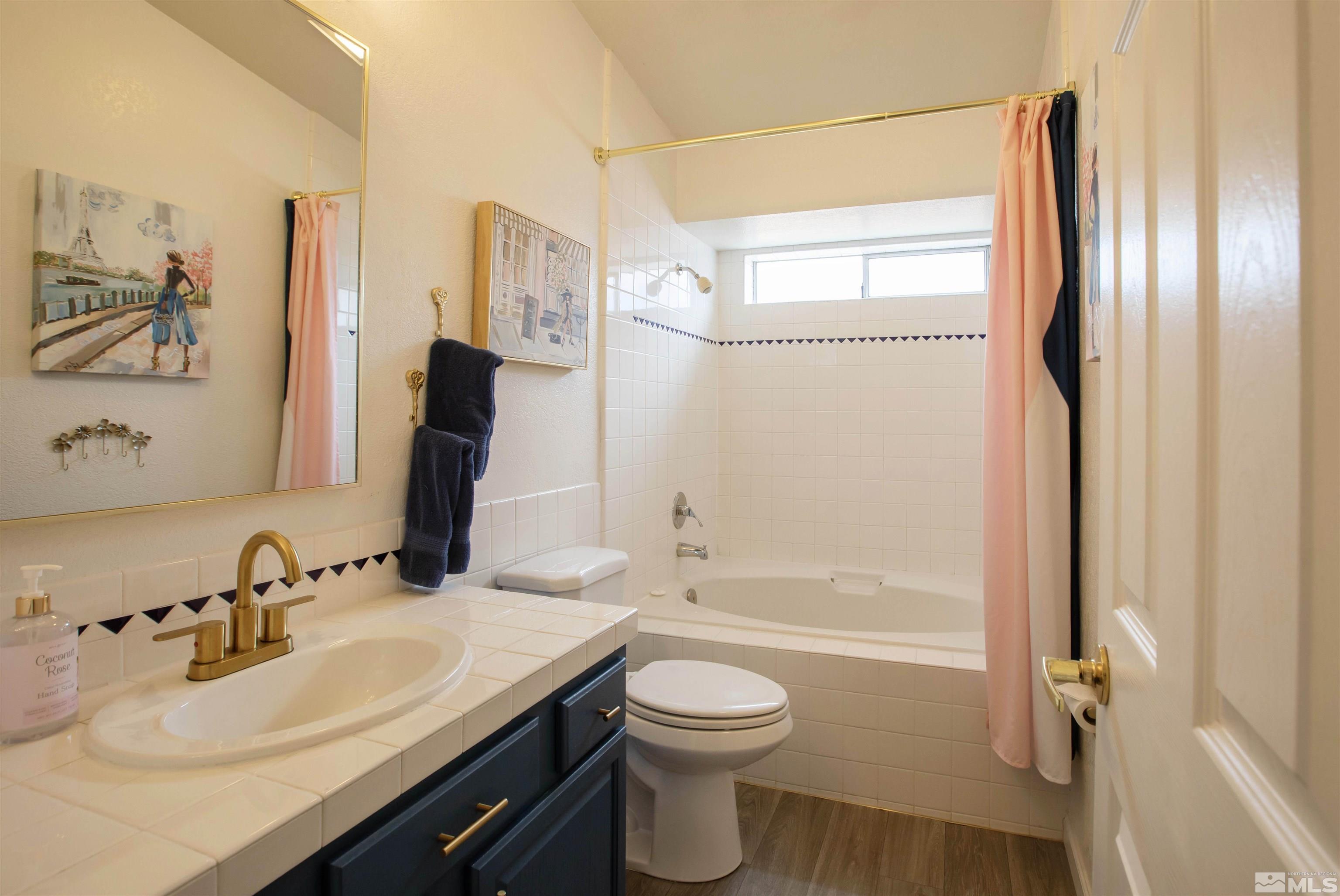 2285 Silver Ridge Drive Reno, NV 89509 - Photo 13 of 19 a bathroom with a sink a toilet and shower