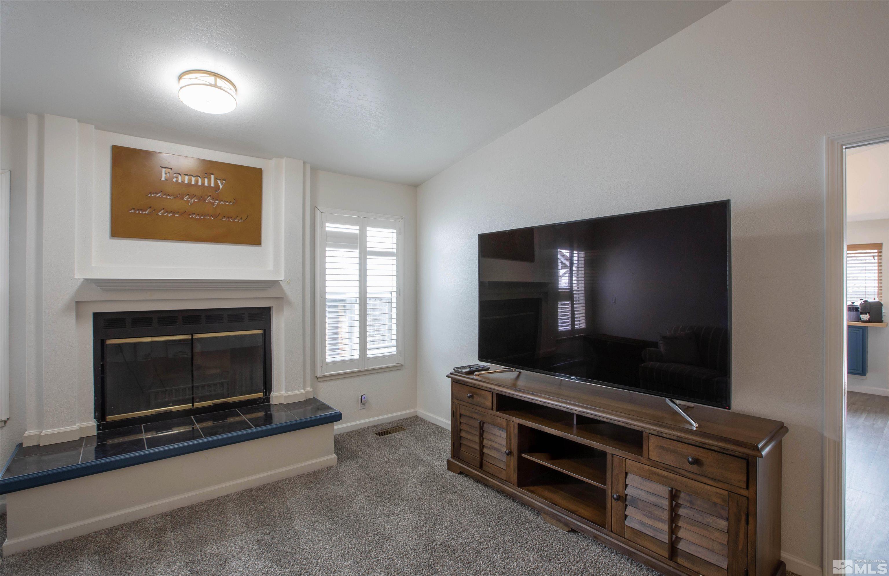 2285 Silver Ridge Drive Reno, NV 89509 - Photo 2 of 19 a living room with furniture and a flat screen tv