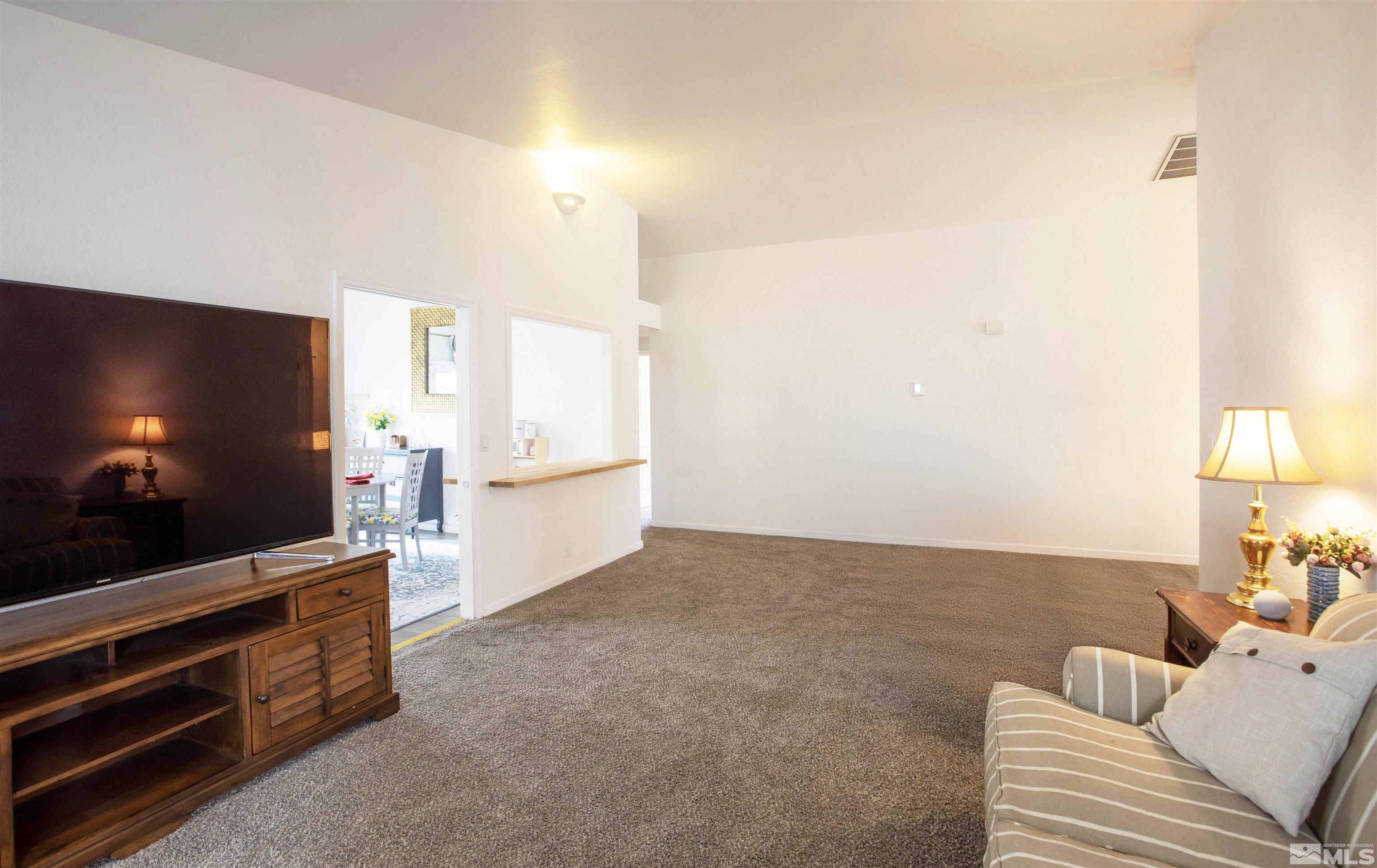 2285 Silver Ridge Drive Reno, NV 89509 - Photo 3 of 19 a living room with furniture and a flat screen tv