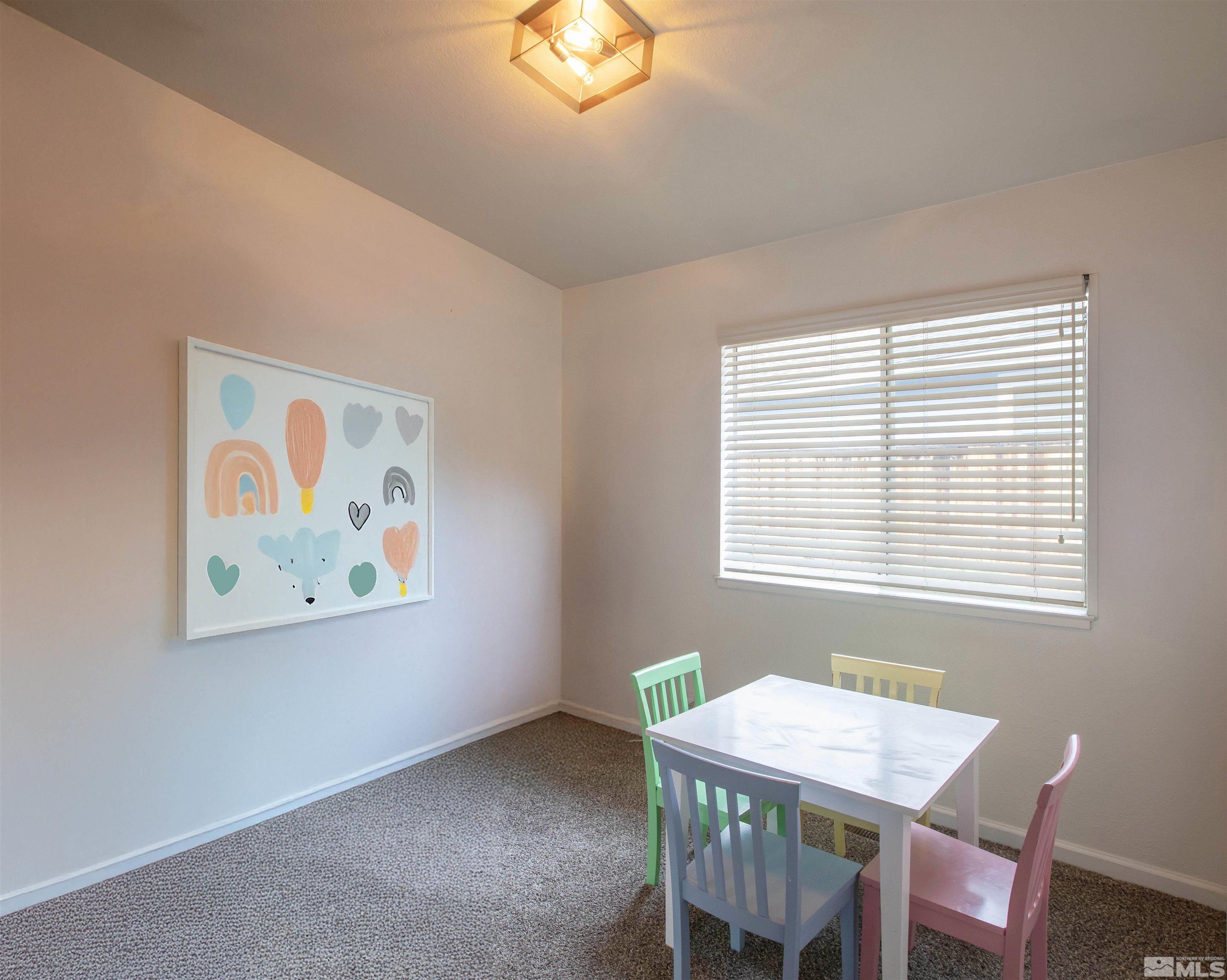 2285 Silver Ridge Drive Reno, NV 89509 - Photo 4 of 19 a view of a dining room with a table and chairs