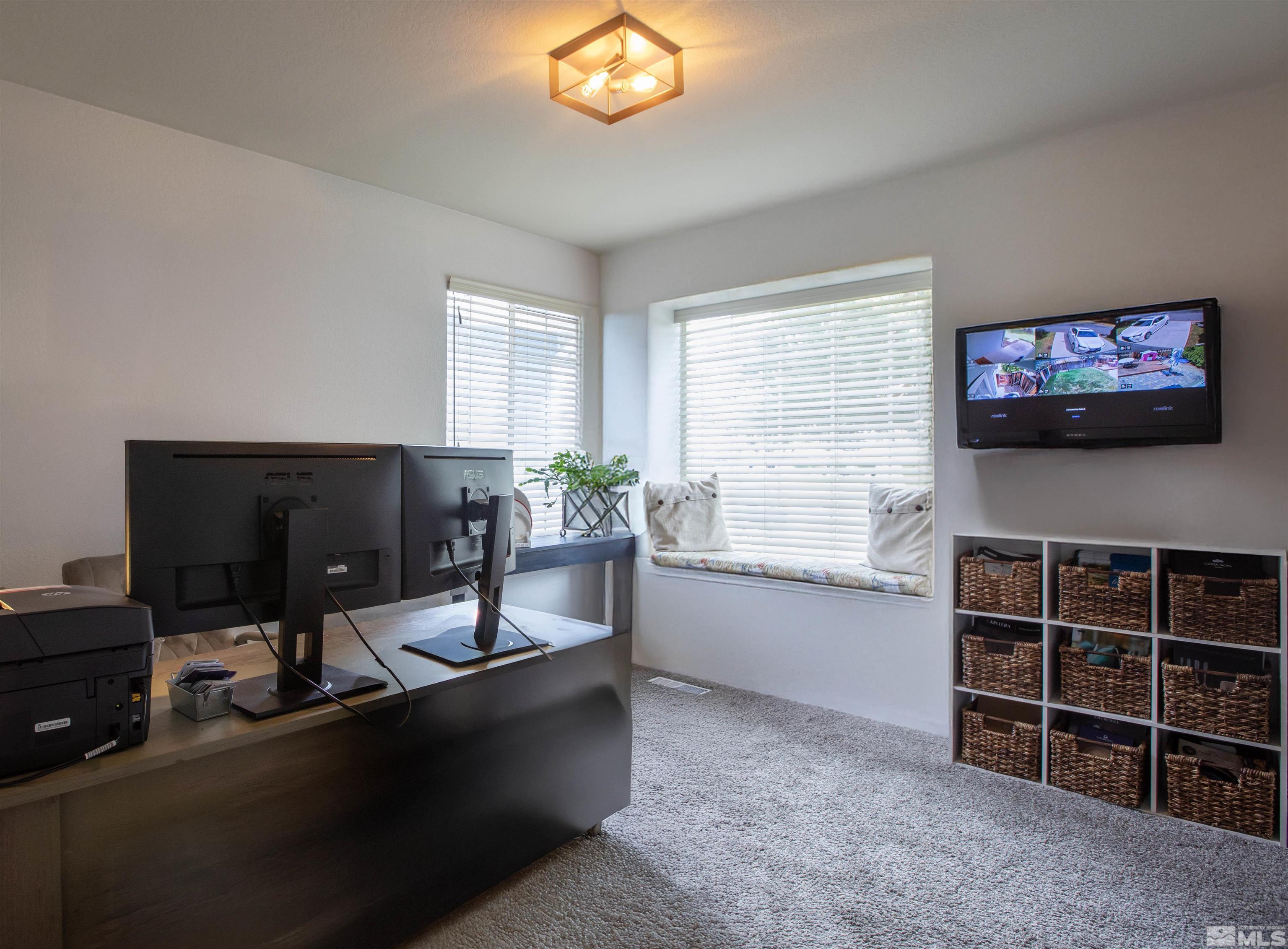 2285 Silver Ridge Drive Reno, NV 89509 - Photo 5 of 19 a living room with furniture a flat screen tv and a window