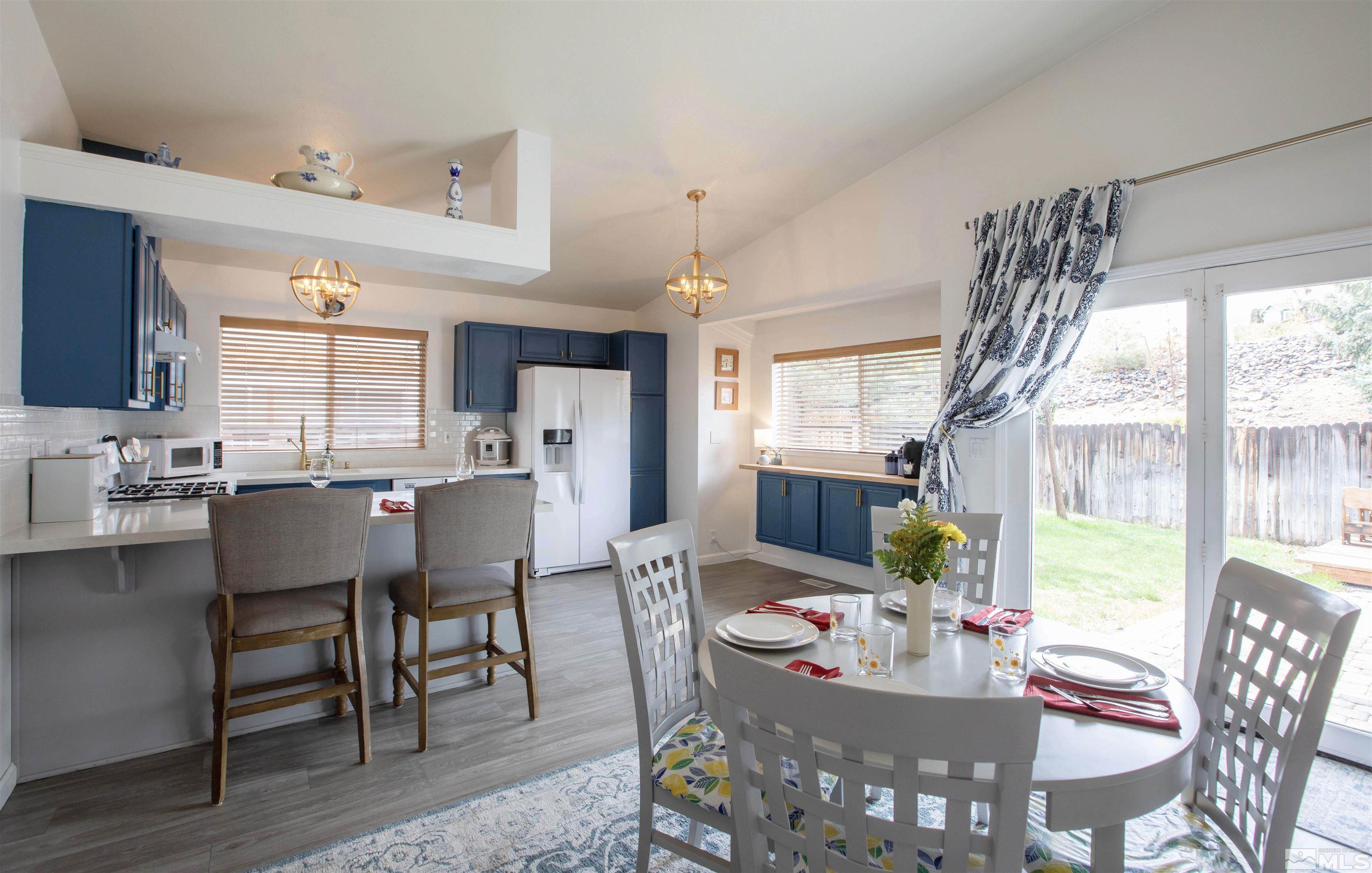 2285 Silver Ridge Drive Reno, NV 89509 - Photo 7 of 19 a view of a dining room with furniture window and outside view