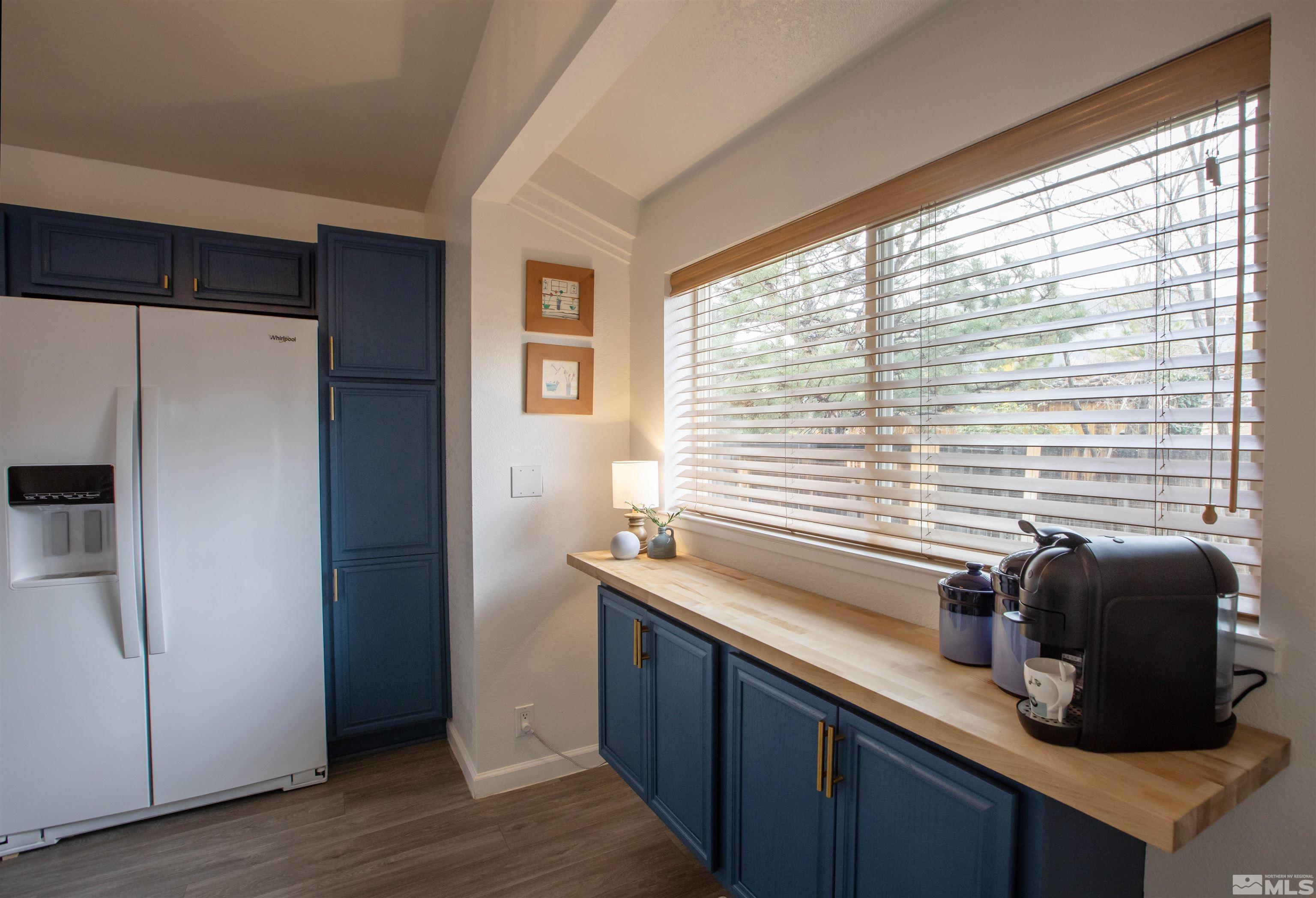 2285 Silver Ridge Drive Reno, NV 89509 - Photo 8 of 19 a kitchen with a window a sink and a refrigerator