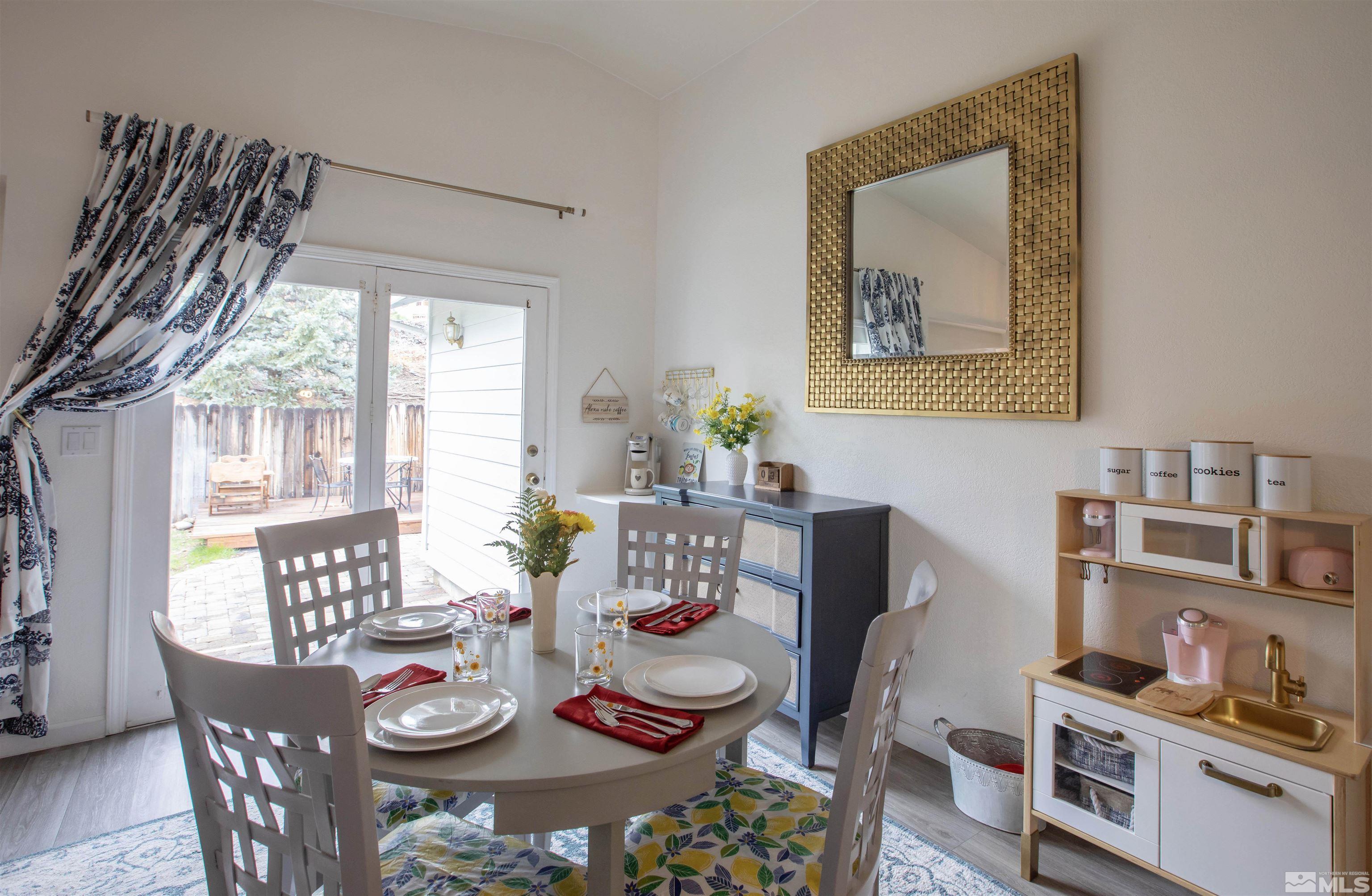 2285 Silver Ridge Drive Reno, NV 89509 - Photo 10 of 19 a view of a dining room with furniture window and outside view