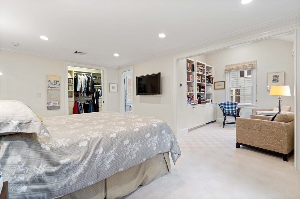 8 Whitney Road Newton, MA 02460 - Photo 14 of 25 a bed room with furniture and a flat screen tv
