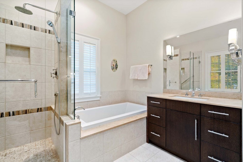 8 Whitney Road Newton, MA 02460 - Photo 16 of 25 a bathroom with a bathtub sink and mirror