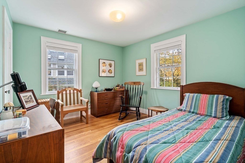 8 Whitney Road Newton, MA 02460 - Photo 18 of 25 a bedroom with two beds and a dresser next to a window