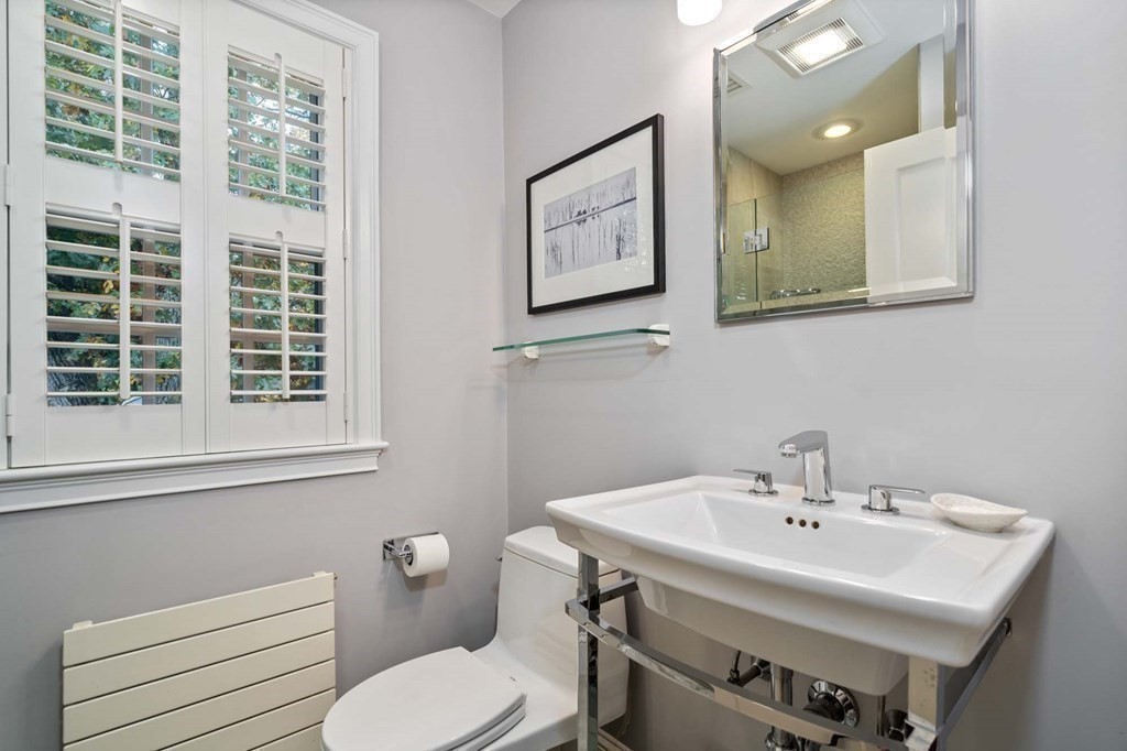 8 Whitney Road Newton, MA 02460 - Photo 19 of 25 a bathroom with a sink and a toilet