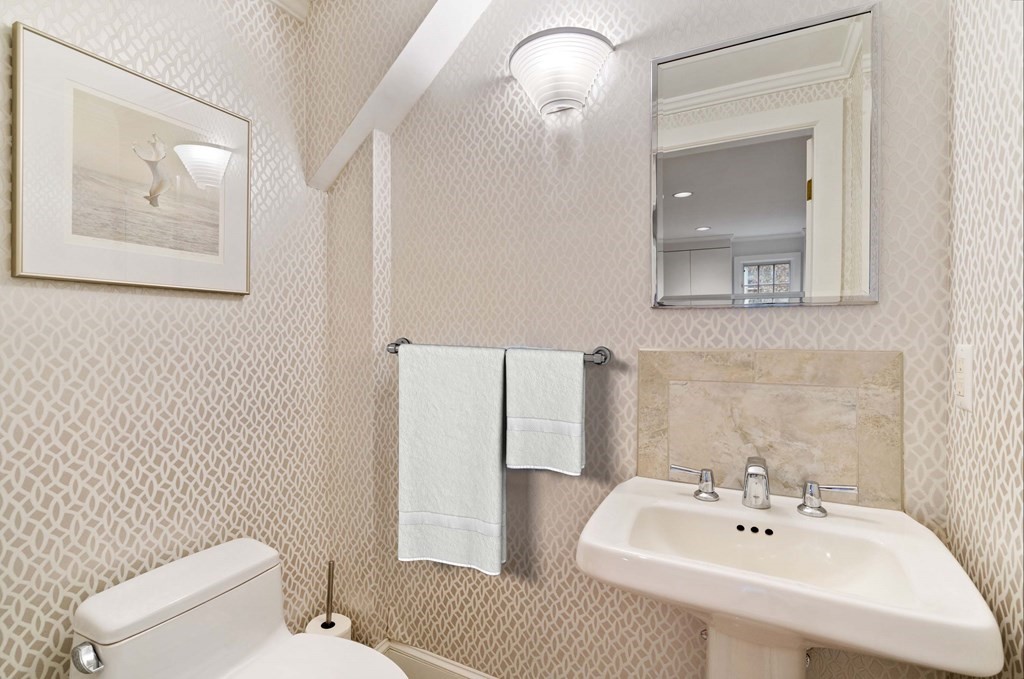 8 Whitney Road Newton, MA 02460 - Photo 20 of 25 a bathroom with a sink mirror and toilet