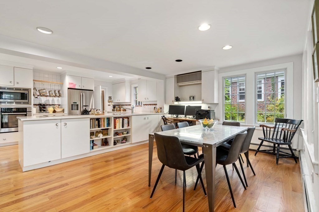 8 Whitney Road Newton, MA 02460 - Photo 5 of 25 a living room with stainless steel appliances kitchen island granite countertop furniture and wooden floor