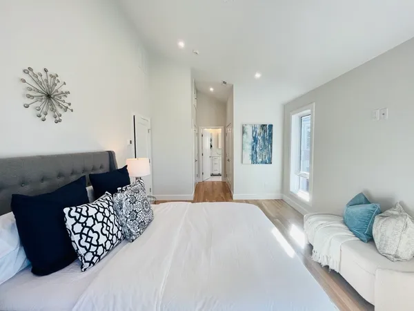 a bedroom with a bed and window