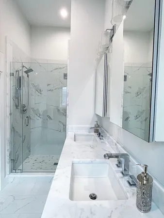 a bathroom with a tub sink and shower