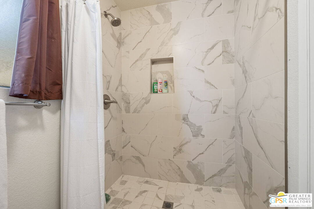 45688 Sutter Creek Road Indio, CA 92201 - Photo 27 of 51 a bathroom with a shower