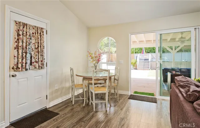 a bedroom with a large bed and a flat screen tv
